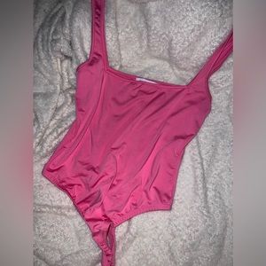 Pink body suit